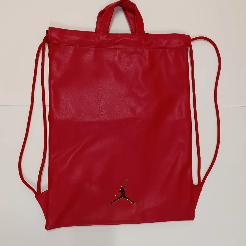 JORDAN Red Faux Leather Drawstring Backpack with Gold Jumpman